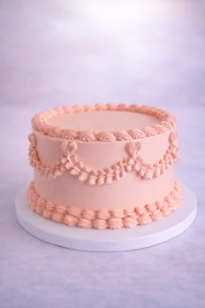 Pink vintage cake with buttercream garlands