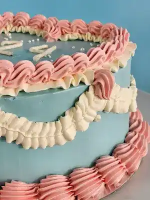 Blue and pink vintage heart cake with buttercream message