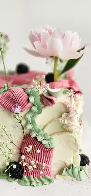 Floral cake with pink flower and textured buttercream
