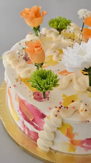 Floral cake detail with orange and white flowers